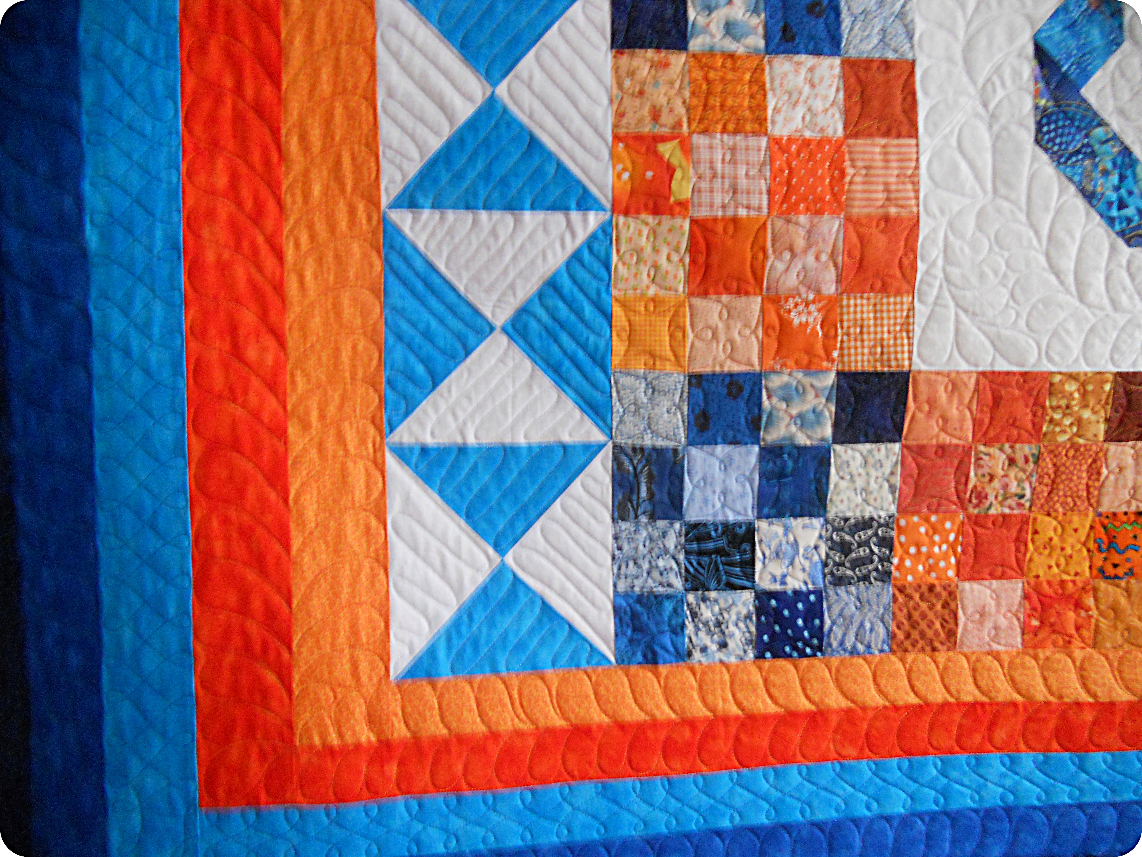 orange and blue quilt bedding